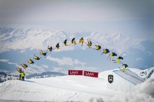 photo composite of skier jumping on a ramp in the mountains