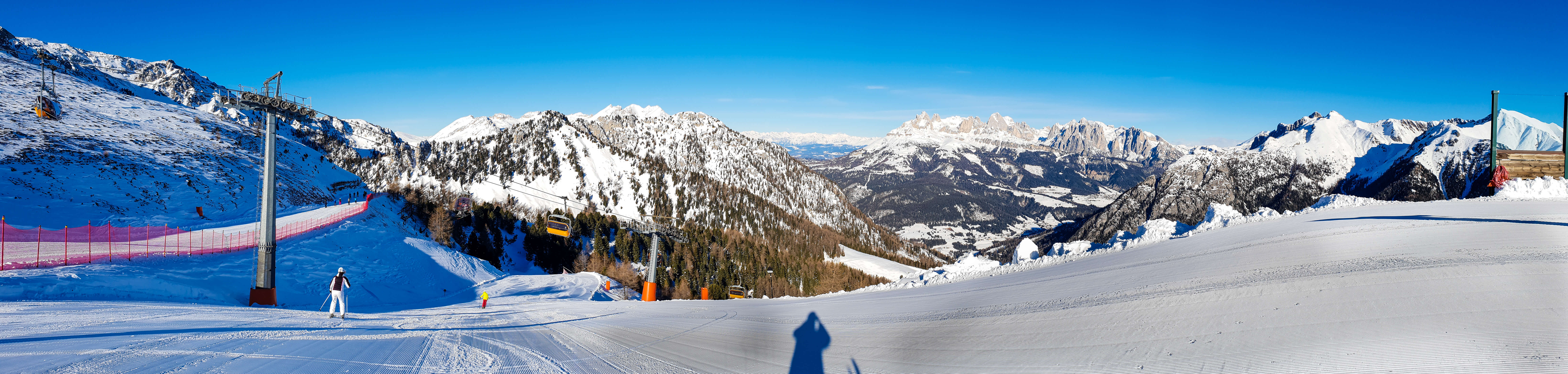 Stunning scenery in dolomites from the top of the mountain shows reasons to ski in italy