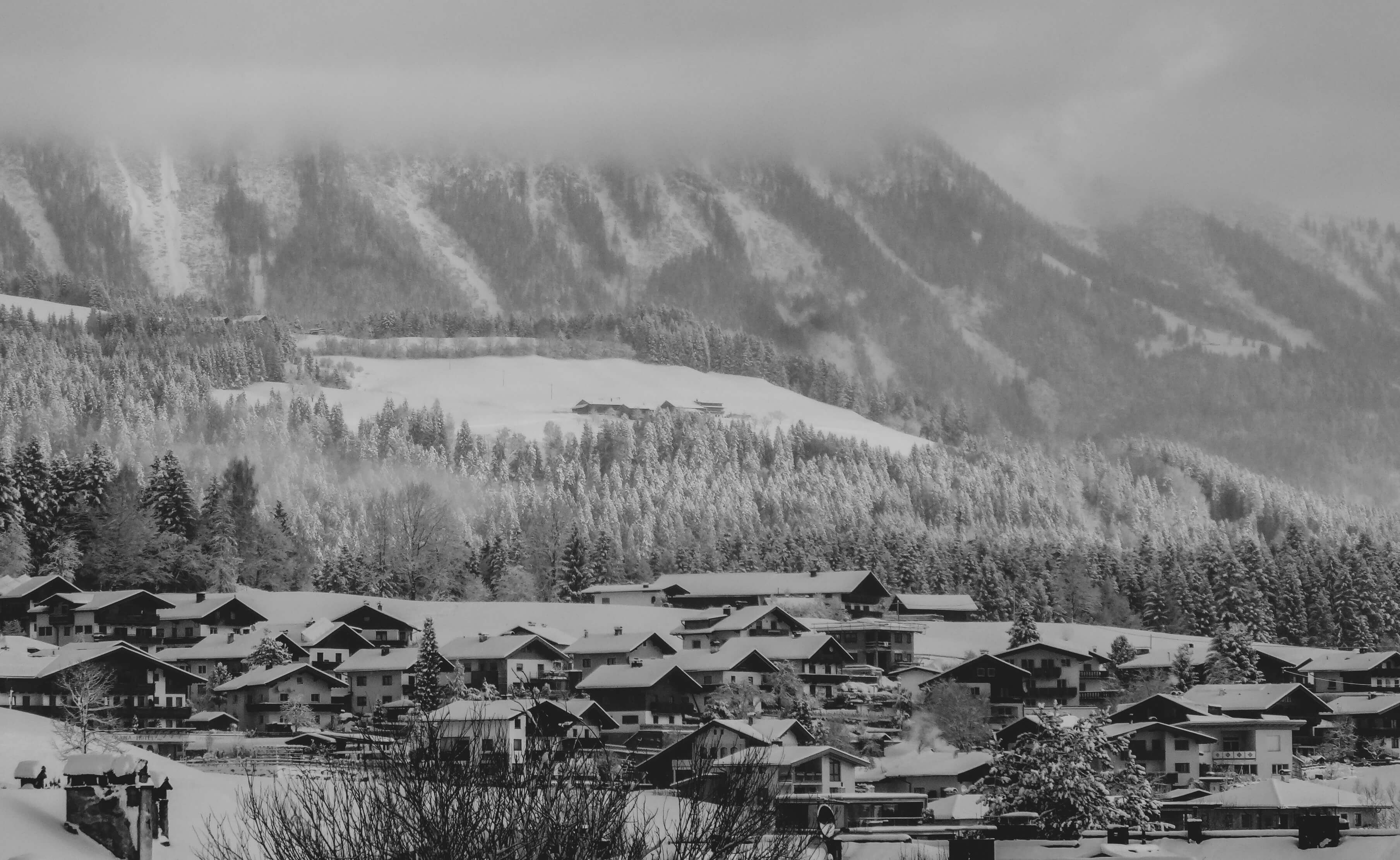 looking out over the rooftops of soll on a fresh powder day in january