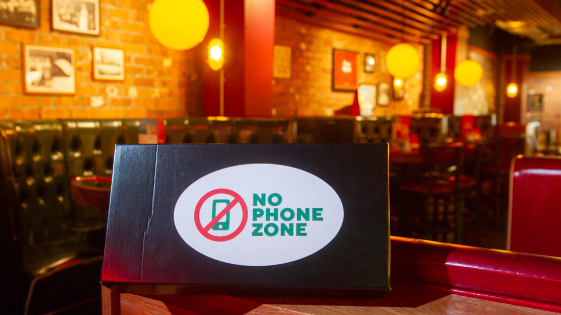 Smartphone Detox - no phone zone sign in a UK restaurant