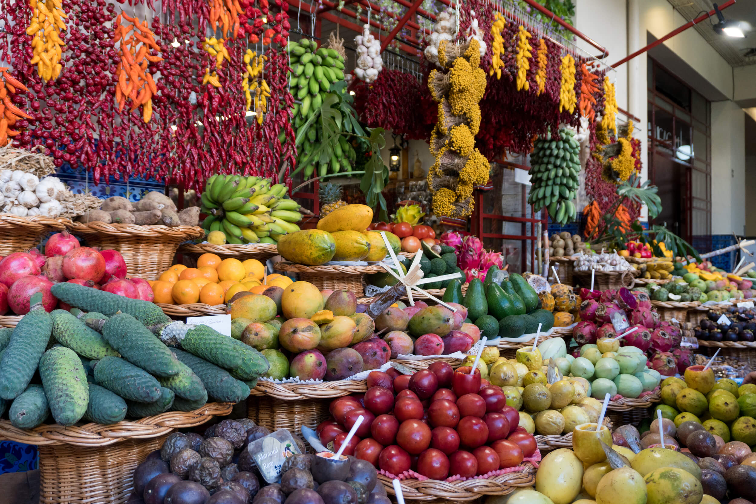 exotic fruits, chillis and vegetables at the farmers market in funchal madeira
