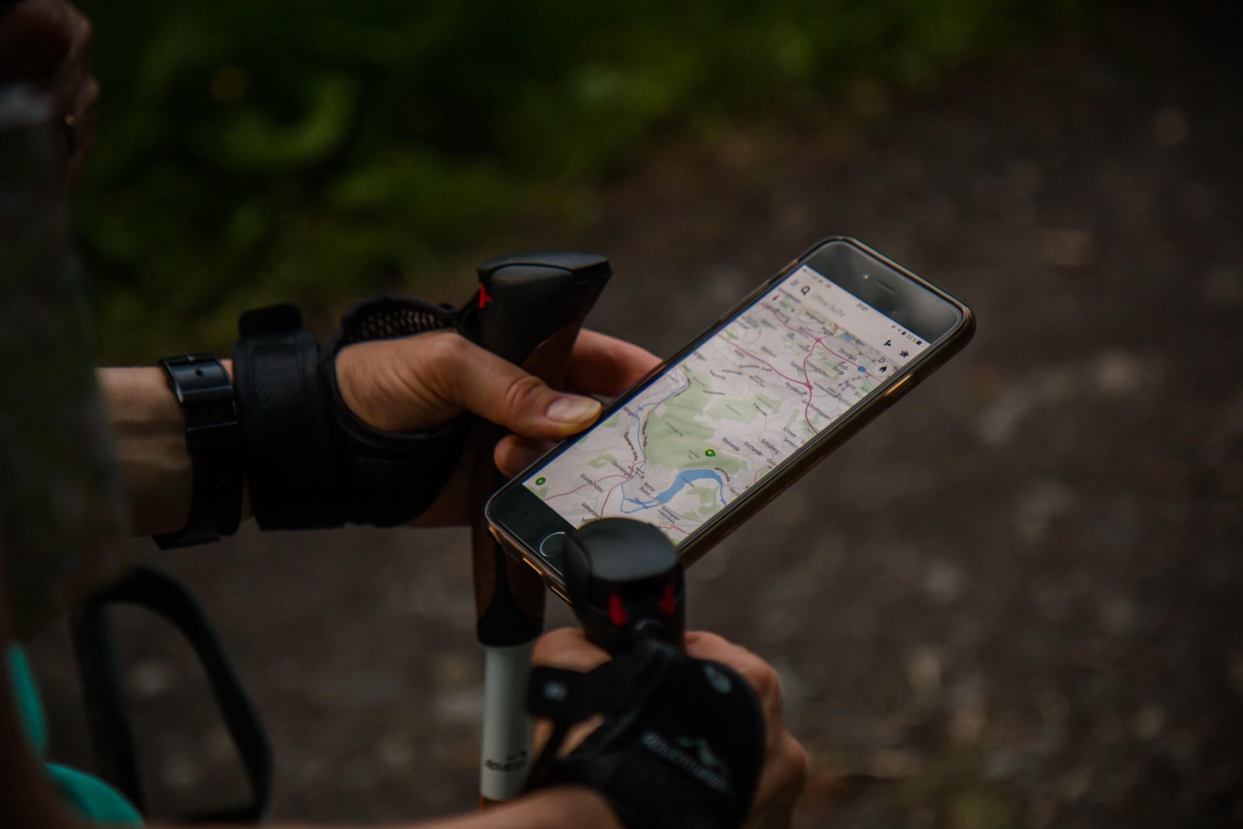 man using navigation on phone whilst walking