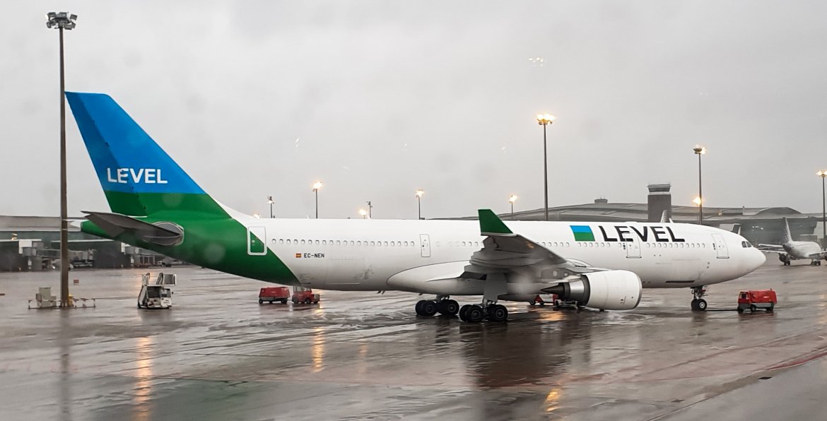 A LEVEL Plane Sitting on a rainy runway in Spain