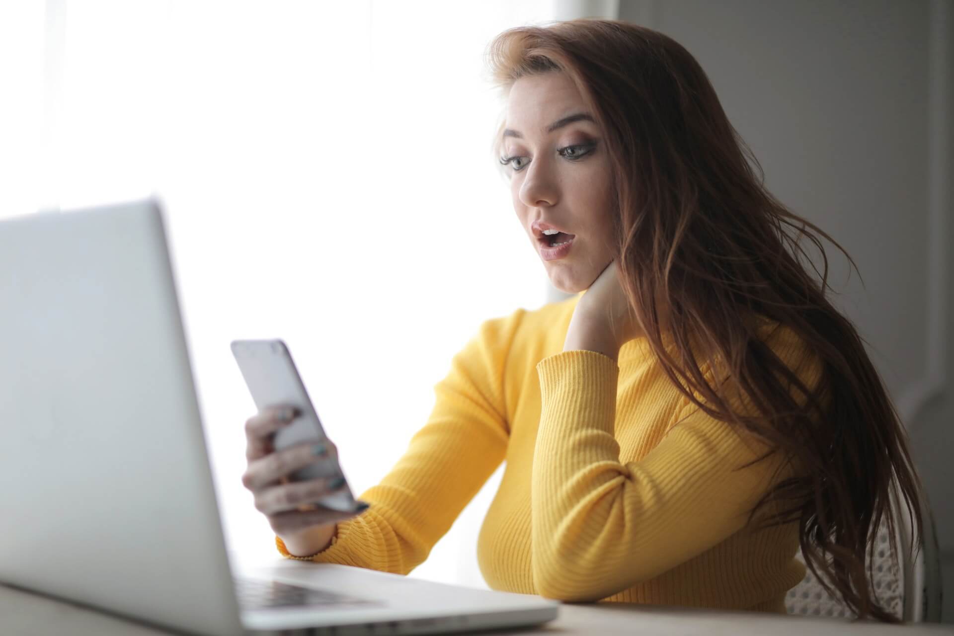 tips to effectively work from home include staying off your phone unlike the girl in the photo